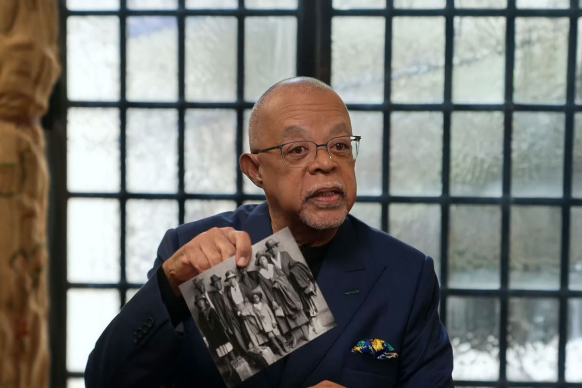 Dr. Henry Louis Gates with a photo of the Arthur family during their group interview. (McGee Media/PBS)