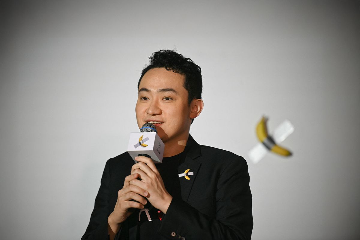 Chinese-born crypto founder Justin Sun speaks before eating a banana artwork composed of a fresh banana stuck to a wall with duct tape, in Hong Kong on November 29, 2024, after buying the provocative work of conceptual art by Italian artist Maurizio Cattelan at a New York auction for $6.2 million. (PETER PARKS/AFP via Getty Images)