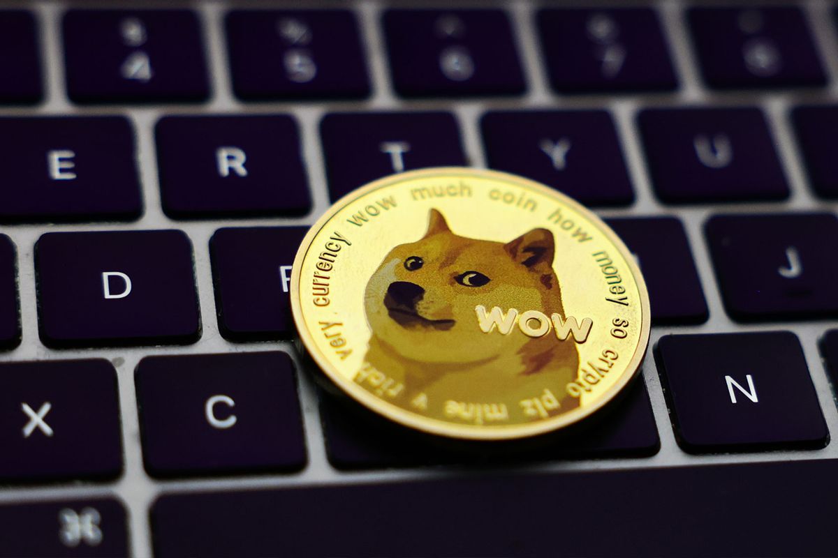 A laptop keyboard and representation of Dogecoin cryptocurrency  (Jakub Porzycki/NurPhoto via Getty Images)