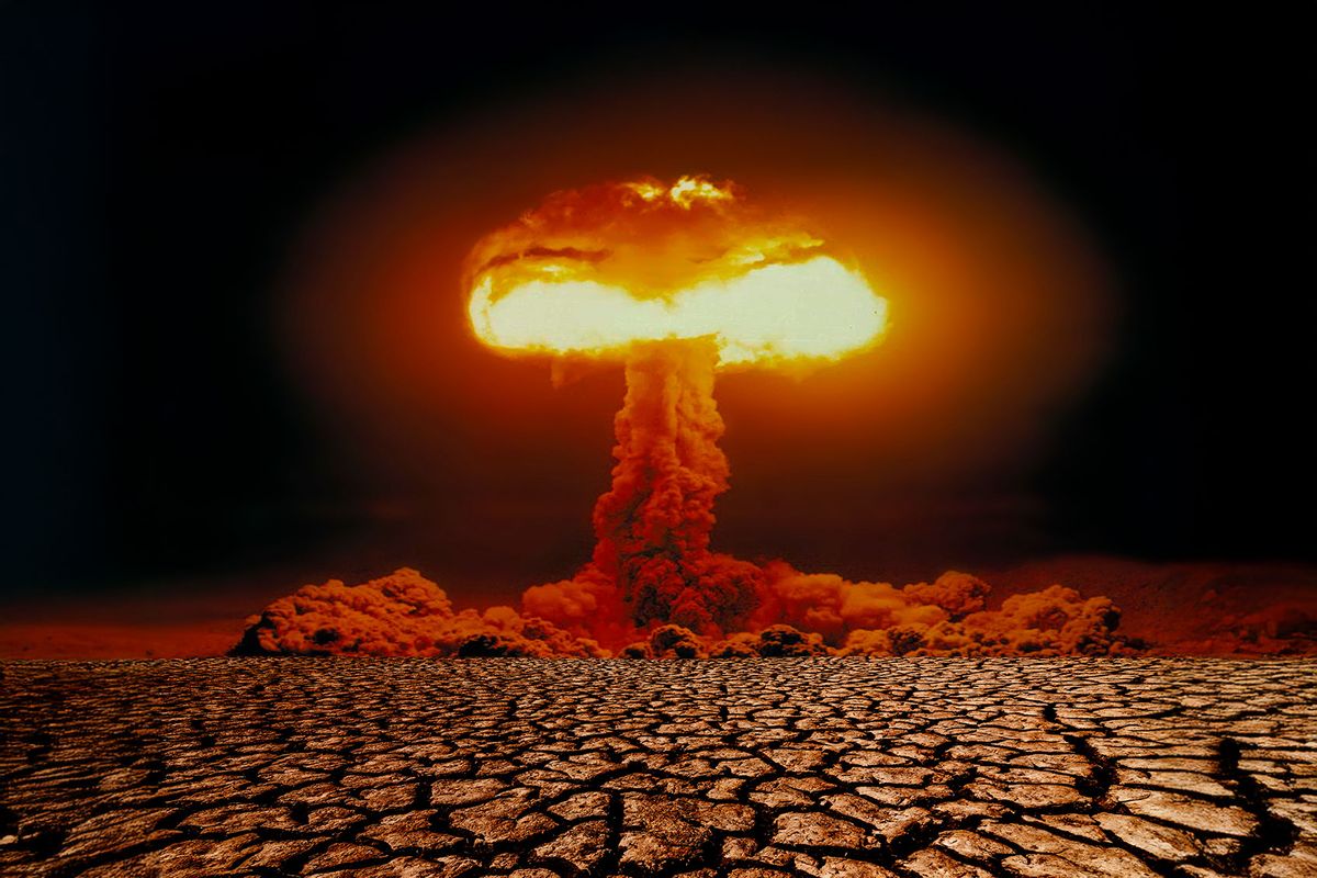 Nuclear explosion with mushroom cloud on scorched earth (Getty Images/Anton Petrus)