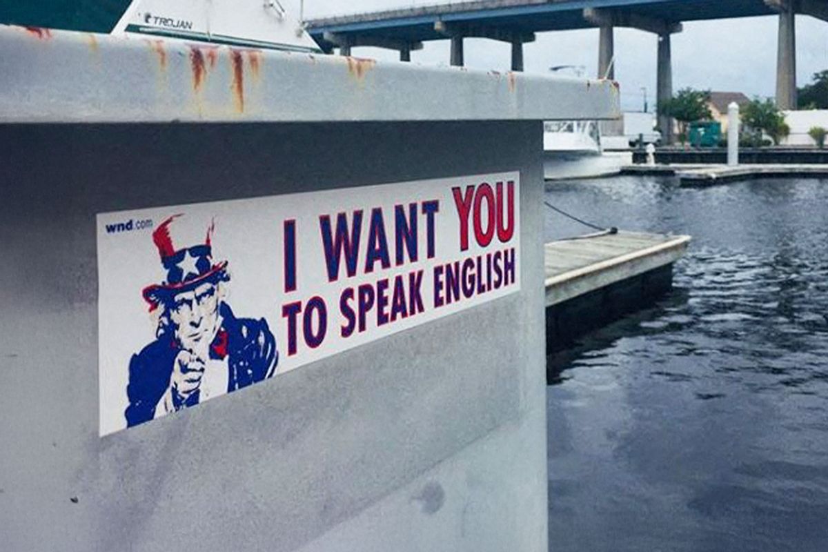A poster is seen on the side of a marina saying "I want you to speak English" at North Myrtle beach, South Caolina on September 13th, 2018. (LEILA MACOR/AFP via Getty Images)