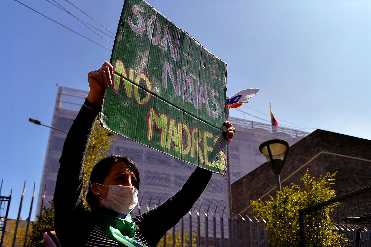 Abortion rights activists demonstrate in front of the National Assembly building in Quito on December 9, 2021. (RODRIGO BUENDIA/AFP via Getty Images)