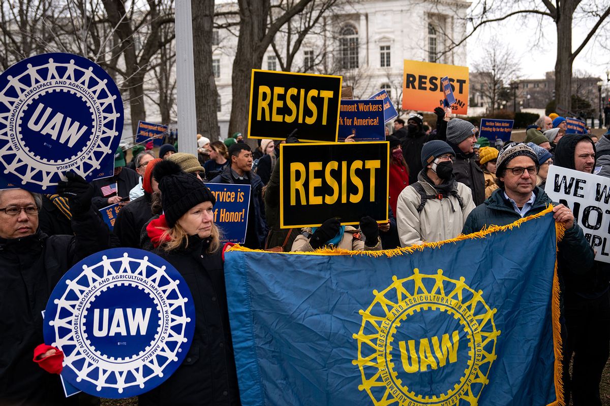 People hold signs as they gather for a "Save the Civil Service" rally hosted by the American Federation of Government Employees (AFGE) outside the U.S. Capitol on February 11, 2025 in Washington, DC. (Kent Nishimura/Getty Images)