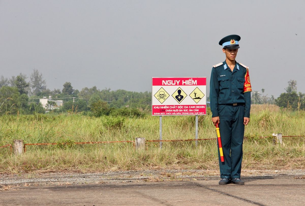 A Vietnamese soldier stands next to a hazardous warning sign by a runway at Bien Hoa air base, on the outskirts of Ho Chi Minh City, as US Defence Secretary Jim Mattis visits the former US air base on October 17, 2018. - The toxic legacy of the Vietnam War came under the spotlight again on October 17 when Mattis visits a former storage site for Agent Orange, which is blamed for birth defects and cancers among a million Vietnamese.  (THOMAS WATKINS/AFP via Getty Images)