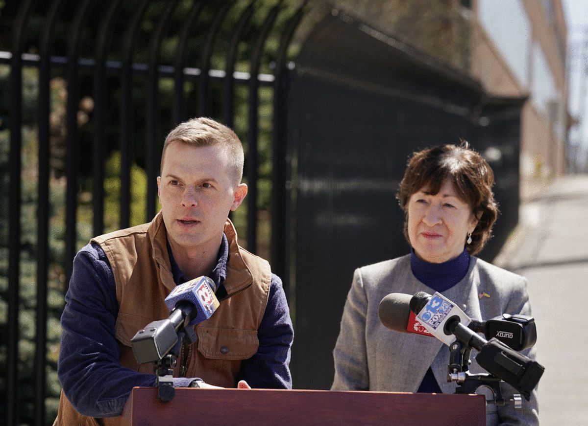 Sen. Susan Collins and Rep. Jared Golden speak outside of Bath Iron Works on April 18, 2022. (Gregory Rec/Portland Press Herald via Getty Images)