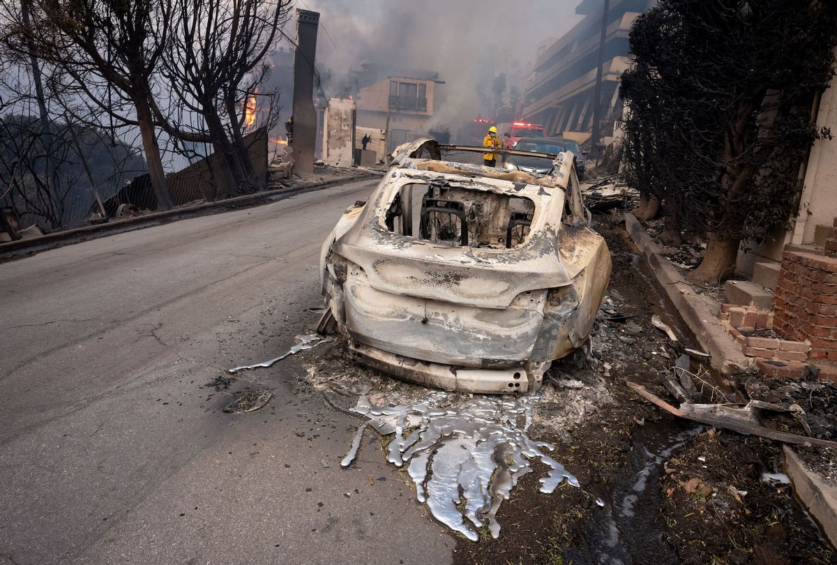 MALIBU, CA - January 08: A Tesla is melted into the street above Pacific Coast Highway in Malibu, CA on Wednesday, January 8, 2025. High winds escalated the spread of several blazes across Southern California.  (Photo by David Crane/MediaNews Group/Los Angeles Daily News via Getty Images)