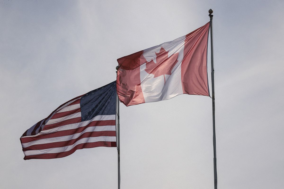 The US and Canadian flags are pictured at Peace Arch Historical State Park in Blaine, Washington, on March 5, 2025.)  (Jason Redmond / AFP) (Photo by JASON REDMOND/AFP via Getty Images)