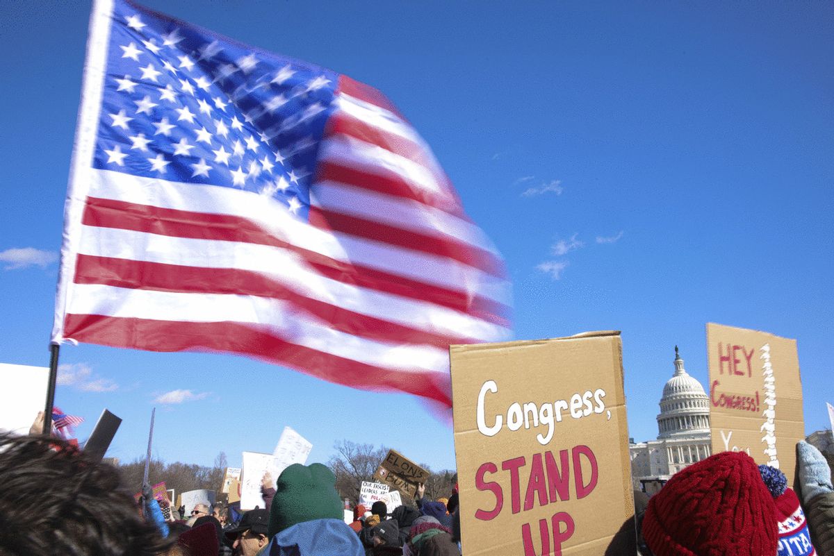 Demonstrators gather at the Capitol Reflecting Pool near the U.S. Capitol in Washington, D.C. on February 17, 2025 to protest against Project 2025 and the Trump administration. (BRYAN DOZIER/Middle East Images/AFP via Getty Images)