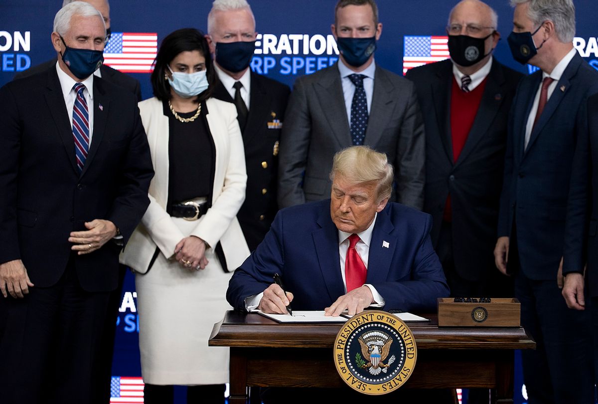 US President Donald Trump signed an executive at the Operation Warp Speed Vaccine Summit on December 08, 2020 in Washington, DC. The president signed an executive order stating the US would provide vaccines to Americans before aiding other nations.  (Photo by Tasos Katopodis/Getty Images)