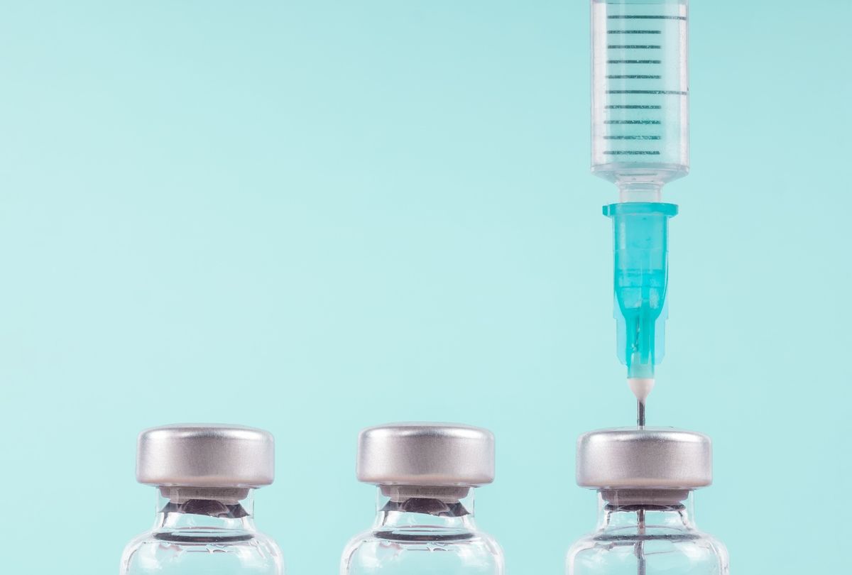 Row of medical vials and syringe.  (A. Martin UW Photography / Getty Images)
