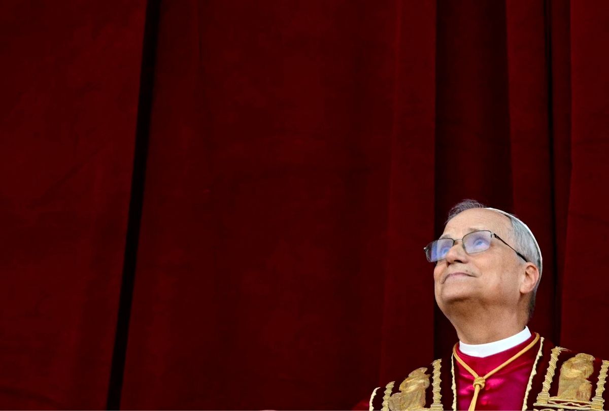 Newly elected Pope Leo XIV, Robert Prevost addresses the crowd from the main central loggia balcony of the St Peter's Basilica for the first time, after the cardinals ended the conclave, in The Vatican, on May 8, 2025. (TIZIANA FABI/AFP via Getty Images)