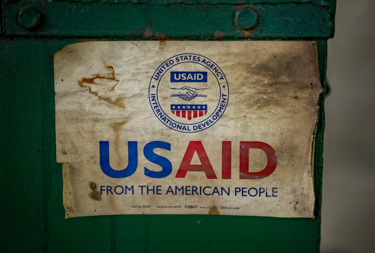 The USAID logo is seen on a machine that processes recycled plastic into construction blocks at the Pasig Eco Hub, a project impacted by the Trump administration's freeze on foreign aid, on March 10, 2025 in Pasig, Metro Manila, Philippines. (Ezra Acayan/Getty Images)
