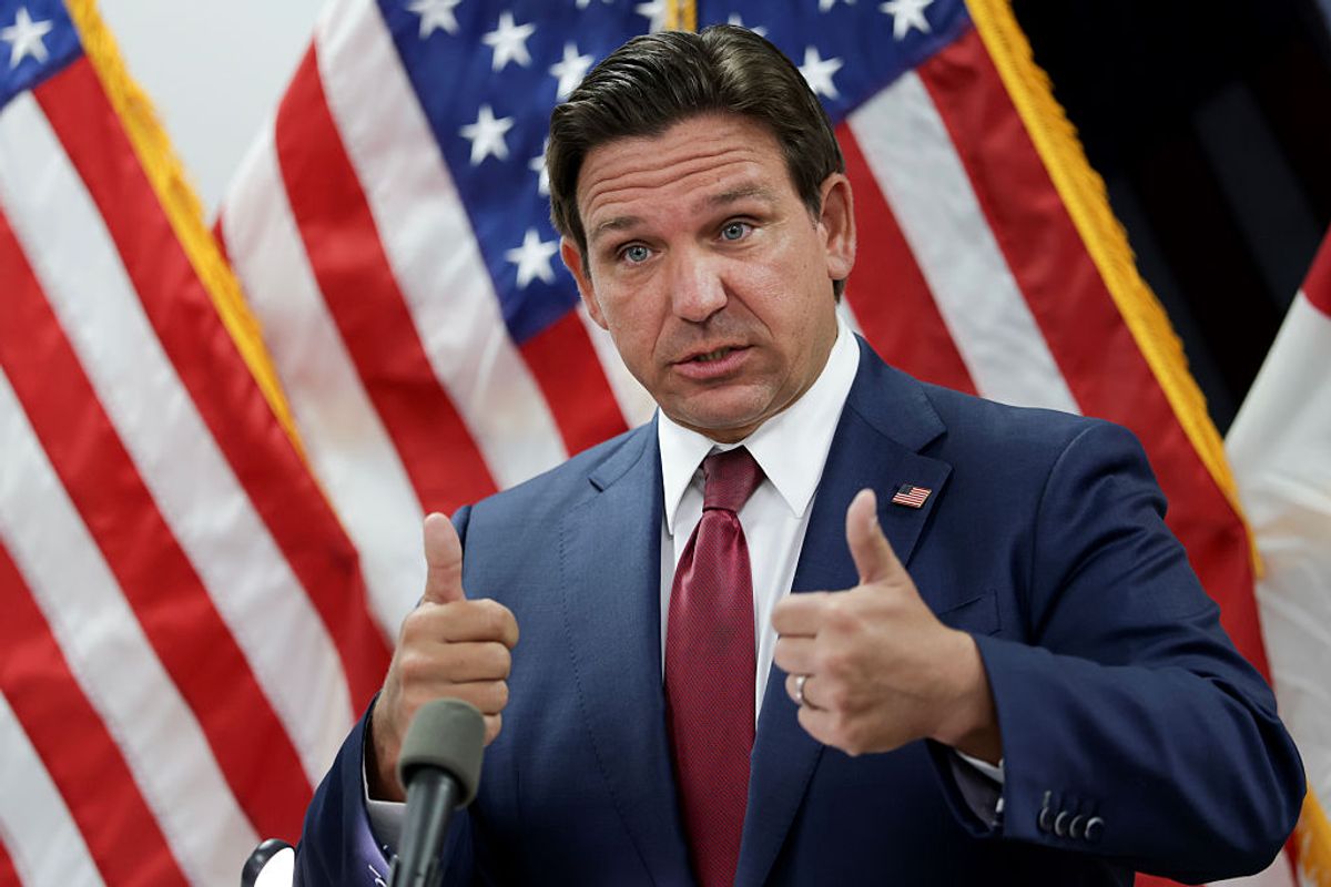 Ahead of today's nationwide scheduled protests, Gov. Ron DeSantis reminds Florida drivers that it's legal to drive through crowds of protesters if they fear for their lives. (Joe Raedle/Getty Images)