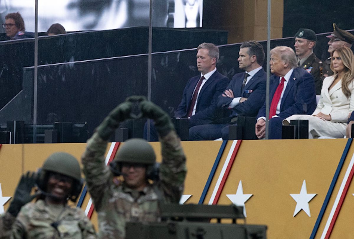 President Trump, sitting alongside Defense Secretary Pete Hegseth and First Lady Melania Trump, observes U.S. Army tanks traveling down Pennsylvania Avenue, during a celebration of the U.S. Army's 250th anniversary and his birthday on Flag Day, June 14, 2025 in Washington. (Tom Brenner For The Washington Post via Getty Images)