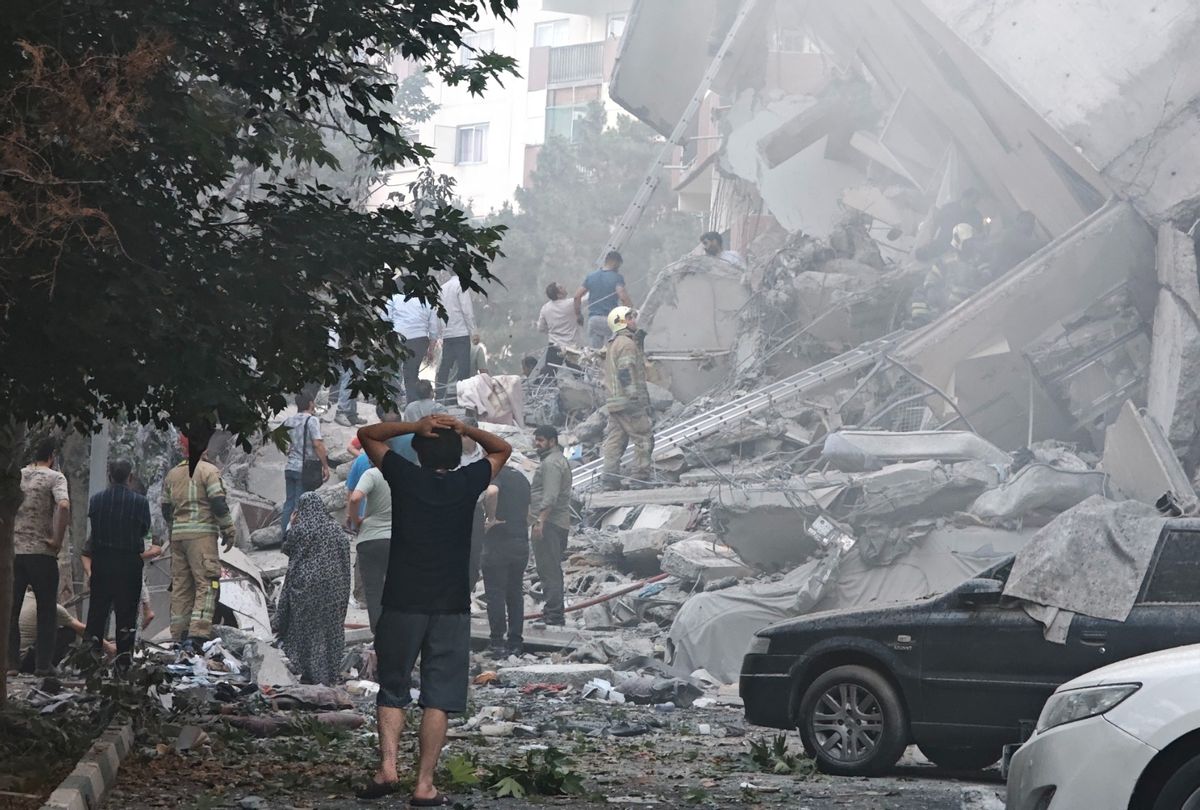 People look over damage to buildings in Nobonyad Square following Israeli airstrikes on June 13, 2025 in Tehran, Iran. Iran's three top military generals were killed in the attacks that also targeted nuclear and military facilities, according to published reports.  (Majid Saeedi/Getty Images)