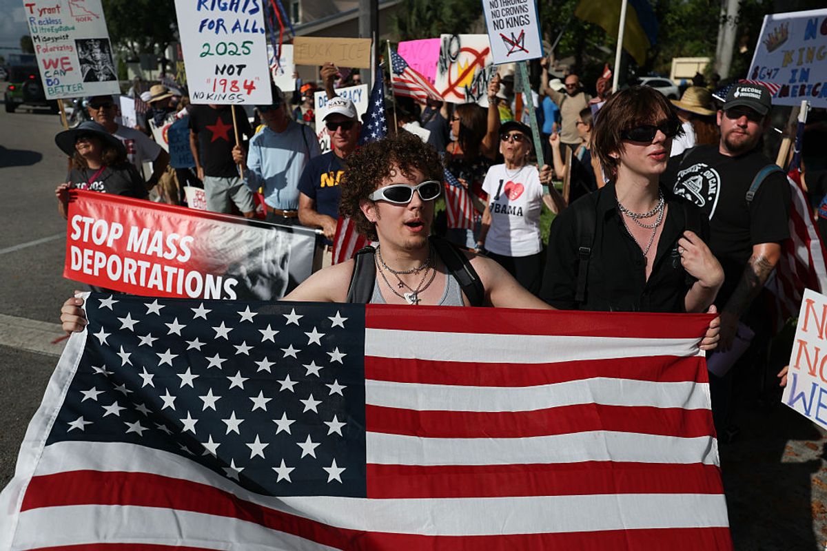 Thousands are turning out for rallies across the U.S. to protest President Trump, while Trump celebrates his birthday tonight in D.C. with a military parade. (Joe Raedle / Getty Images)