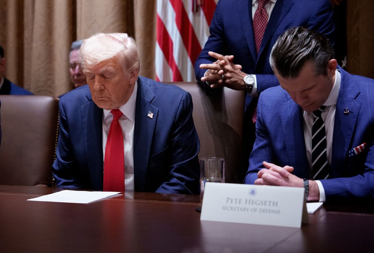 President Donald Trump and Defense Secretary Pete Hegseth pray during a Cabinet meeting at the White House on February 26, 2025 in Washington, DC. (Andrew Harnik/Getty Images)