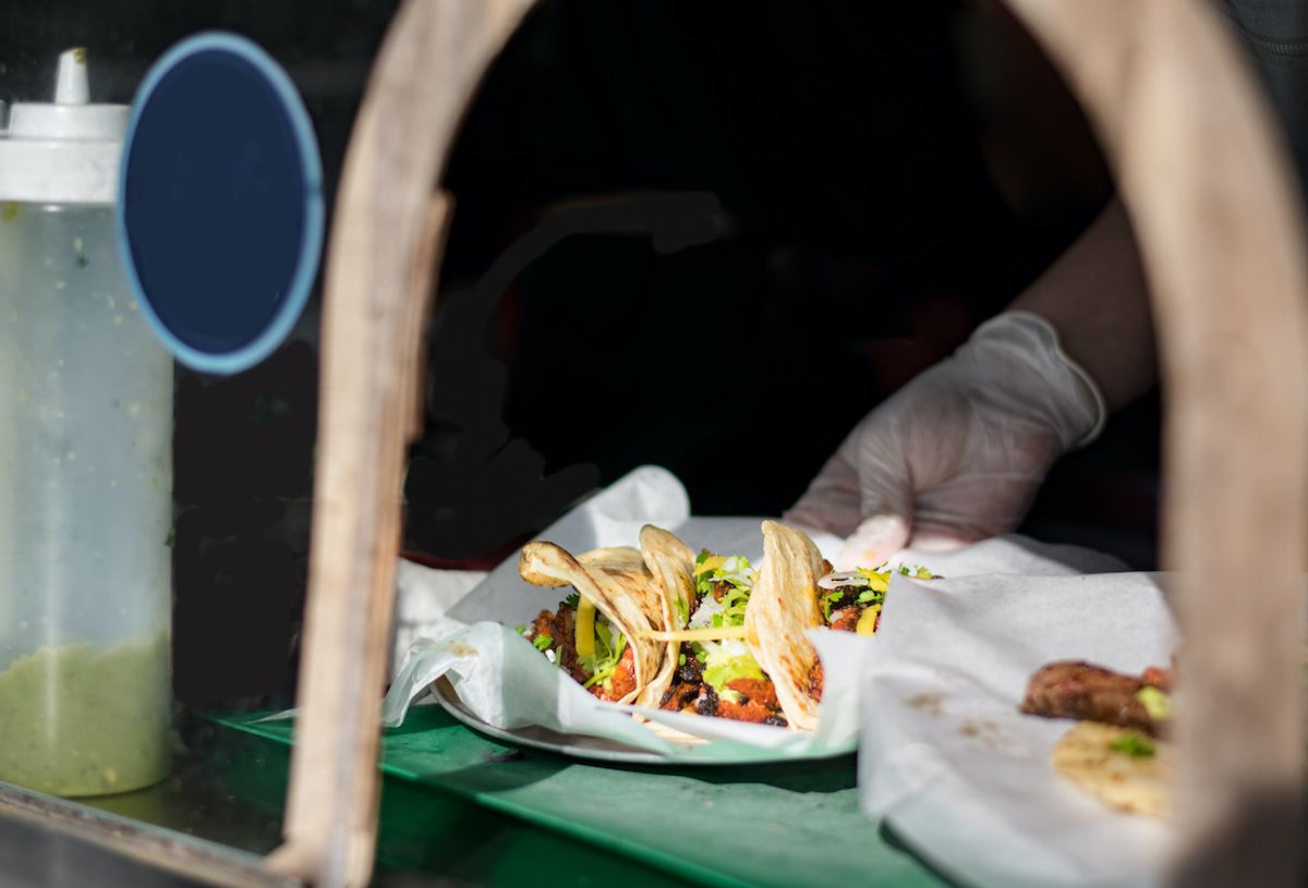 Tacos being served at a taco truck (Ben Wehrman / Getty Images )