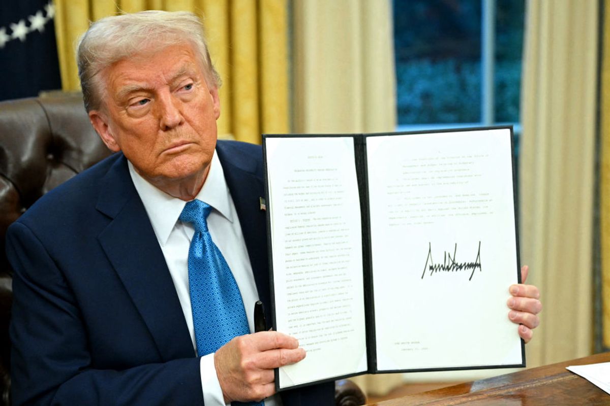 President Trump has signed many executive orders in four months. One instituted merit-based hiring, which MAGA turned into a loyalty test. (MANDEL NGAN / Getty Images)