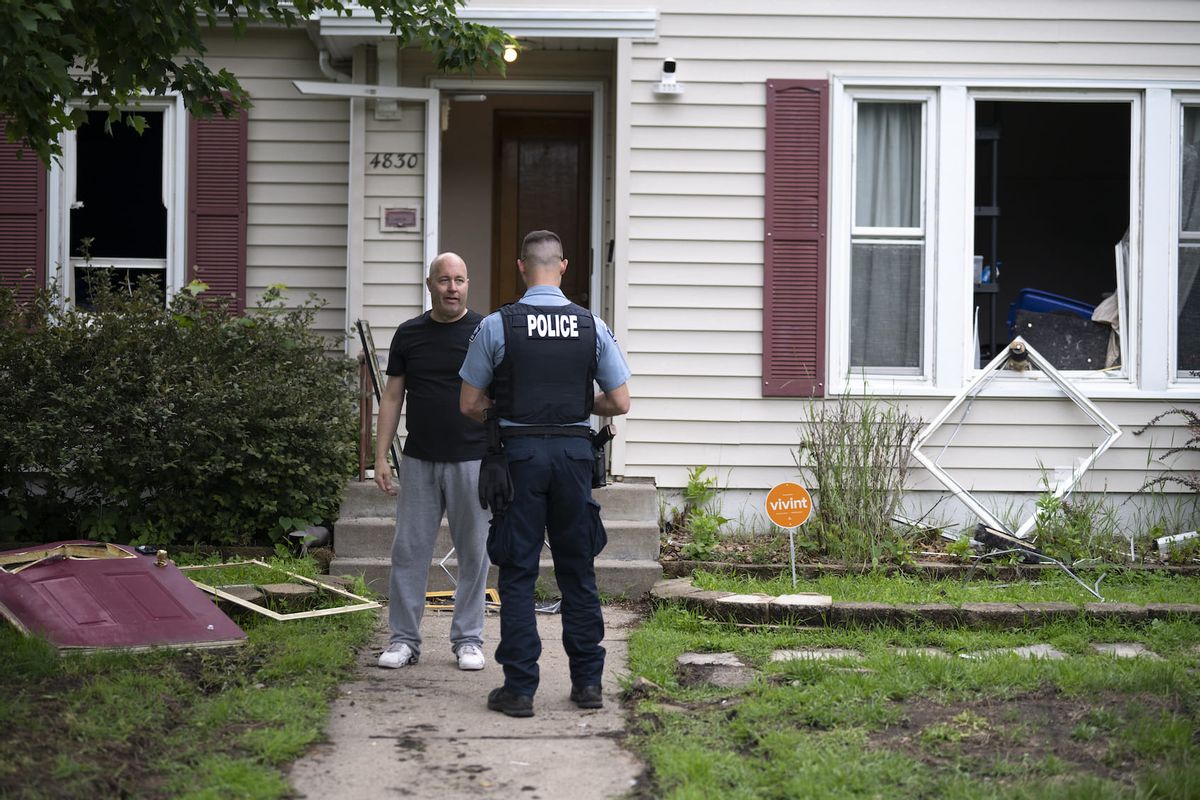 Vance Boelter's roommate, who declined to give his name, speaks with a Minneapolis police officer outside his home on June 14, 2025 in Minneapolis, Minnesota. Boelter, a suspect in the shooting of two Democratic-Farmer-Labor lawmakers. DFL State Rep. Melissa Hortman and her husband, Mark Hortman, were shot and killed this morning. DFL State Sen. John Hoffman and his wife were also shot and hospitalized in a separate incident. (Photo by Stephen Maturen/Getty Images)