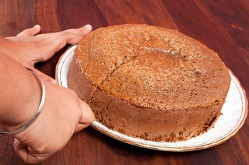 Homemade Chocolate Cake placed on the Wooden Table