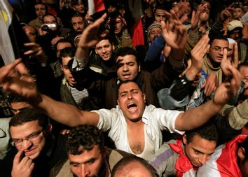 Opposition supporters shout in their stronghold of Tahrir Square