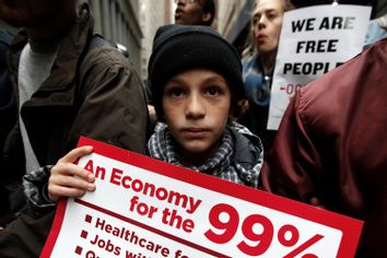 An Occupy Wall Street demonstrator holds a sign during what protest organizers call a 