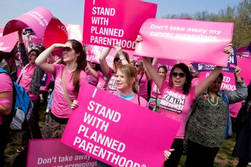 Members of Planned Parenthood, NARAL Pro-Choice America and more than 20 other organizations hold a 