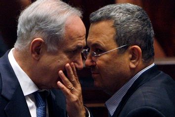 Israel's Prime Minister Benjamin Netanyahu speaks with Defence Minister Ehud Barak