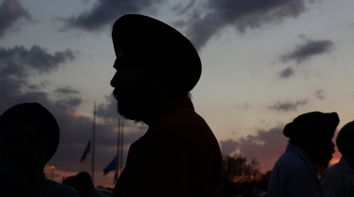Flags fly at half staff as Sikhs prepare for a vigil in Oak Creek
