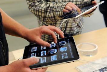 Tablet-Computer und Smartphones fassen in der Geschaeftswelt Fuss
