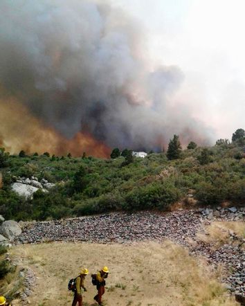 Firefighters move away from the Yarnell Hill Fire, near the town of Yarnell, Arizona in this handout photo