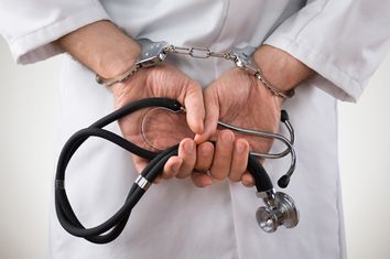 Doctor Hands In Handcuffs