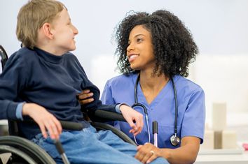 Nurse Talking to a Disabled Child