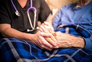 Hospice Nurse and Elderly Patient