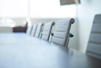 Row of empty chairs in board room