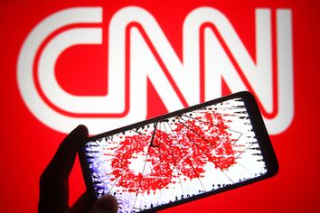 CNN logo distorted on cracked phone screen