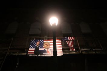 A poster of President Donald Trump is displayed along a street on October 29, 2020 in Winterset, Iowa.