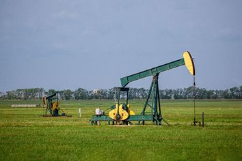 A pair of oil jacks pump crude oil from a Kansas prairie