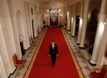 U.S. President Barack Obama walks to a news conference at the White House in Washington