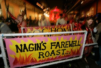 Revelers carry a banner referring to outgoing New Orleans mayor Nagin during the Krewe du Vieux Mardi Gras parade in New Orleans