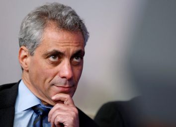 White House Chief of Staff Emanuel listens to U.S. President Obama during a news conference in Washington