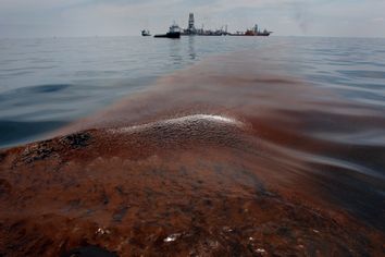 Dispersed oil floats on the surface of the Gulf of Mexico waters close to the site of the BP oil spill off Louisiana