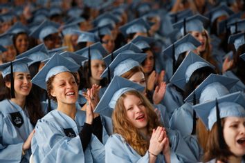 Graduating seniors cheer at the commencement for Barnard College, in New York