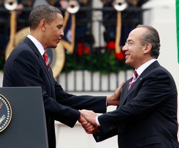 U.S. President Barack Obama shakes hands with Mexico's President Calderon at the White House in Washington