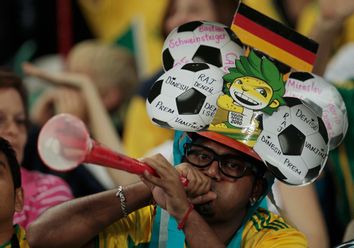 Soccer fan blows the vuvuzela trumpet before the start of the 2010 World Cup Group D soccer match between Germany and Australia at Moses Mabhida stadium in Durban