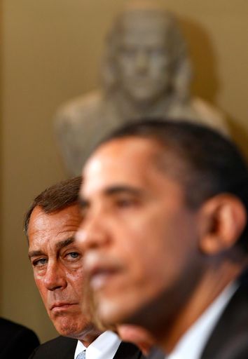 House Republican Leader Boehner watches U.S. President Obama at the White House in Washington