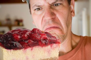 Man Eating Pepperoni Pizza