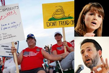 A couple holds protest signs at America's Tea Party held at Southfork Ranch in Parker