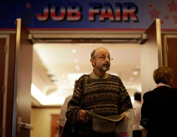 A man walks out of a job fair for military veterans and other unemployed people in Los Angeles
